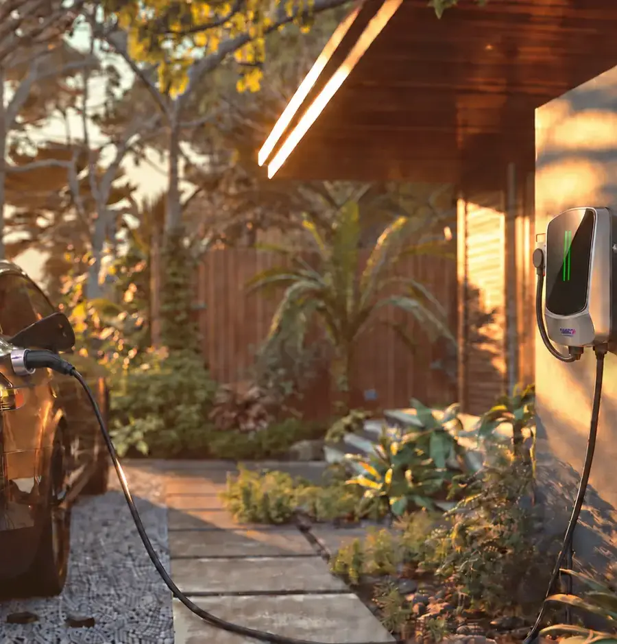 Portable vs. Wall-Mounted EV Chargers: Which Is Better for Home Charging? Electric car connected to a wall-mounted QIAO Q6 home EV charger at sunset.